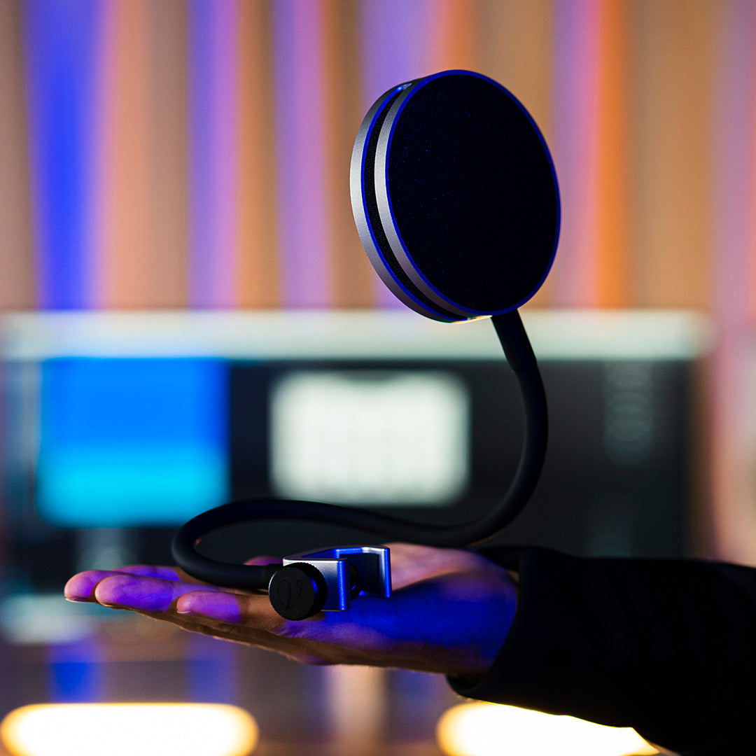 premium pop filter ISOPOP placed on a hand in a home studio