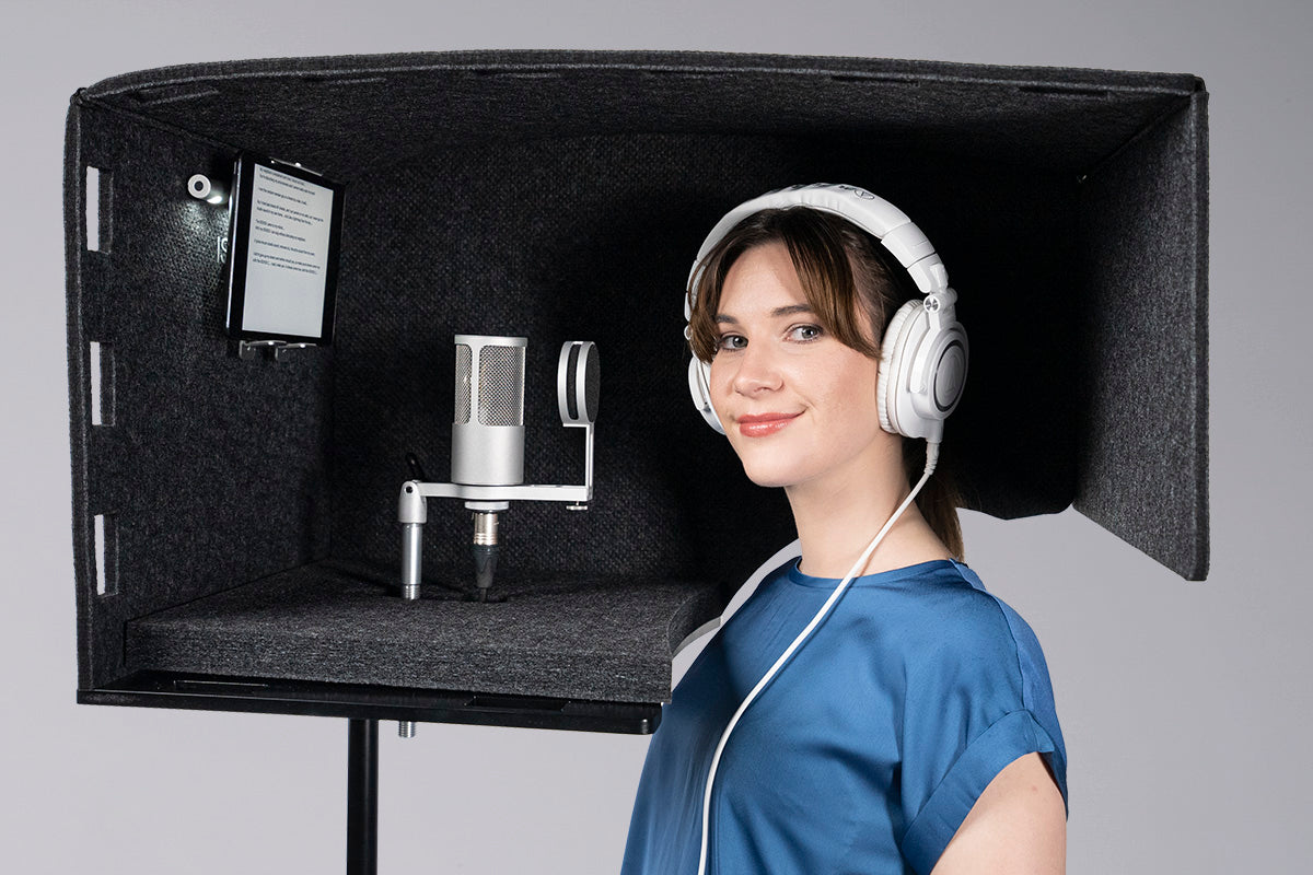Woman standing inside the isovox go home recording booth